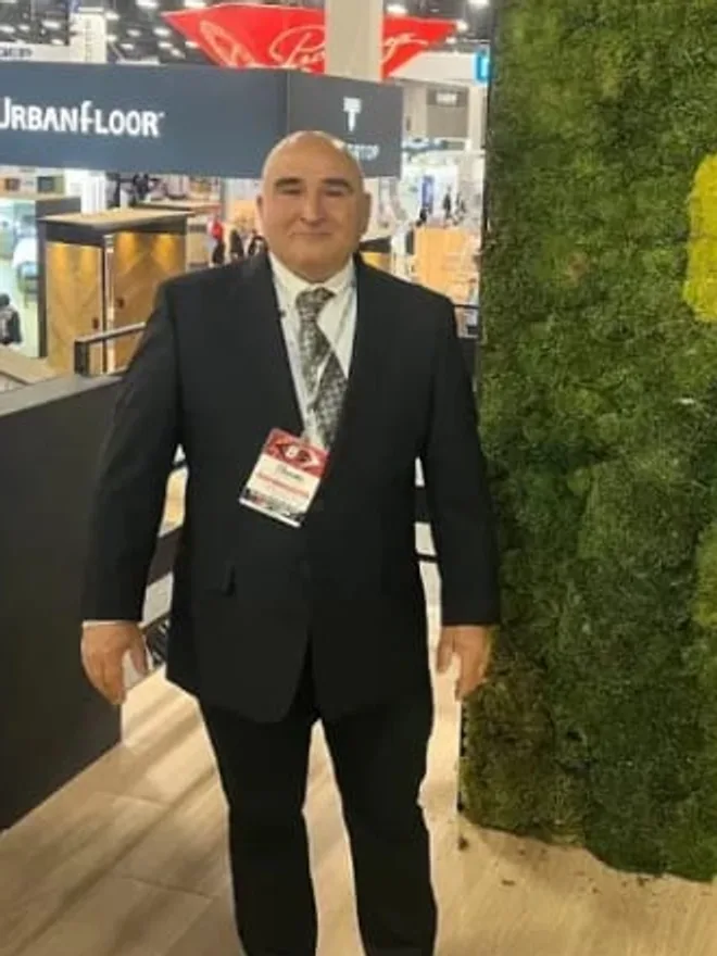 Kavoos Rad, owner of Capital Carpet LLC, at a flooring industry trade show